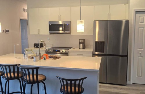 Palm Bay House | Cozy 4-bedroom house in tranquil Palm Bay with WiFi, AC. 30 minutes from beach.
