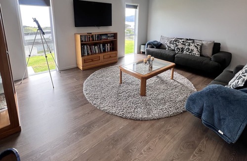 Cable Bay House | Above The Rest is positioned perfect with a view across the bay.