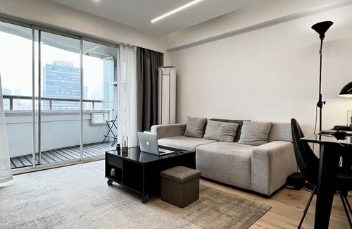 Huaihai Road Commercial Area Apartment | peaceful urban retreat in a stylish minimal apartment with views across the city
