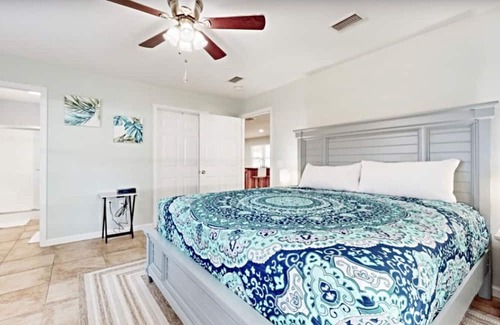 Fort Bay Villa | Green House in Florida w/Trees Surrounding