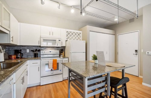 Mill District Apartment | CozySuites Mill District with pool, gym #01