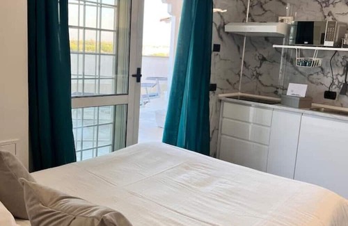 Zona XXXI Mezzocammino Apartment | Vrbo Property