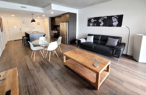 Fabreville Apartment | Corporate Stays -Relax & unwind with 1BR exclusive amenities with Rooftop Access