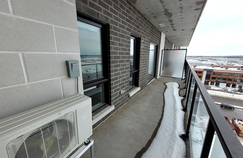 Fabreville Apartment | Corporate Stays -Relax & unwind with 1BR exclusive amenities with Rooftop Access