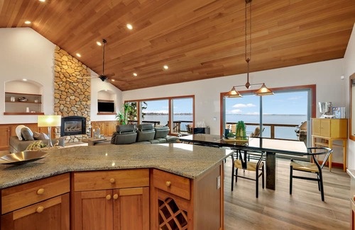 Sandpoint House | Waterfront home with private dock, beach, hot tub & wrap-around deck