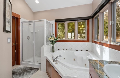 Sandpoint House | Waterfront home with private dock, beach, hot tub & wrap-around deck