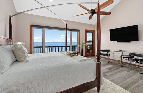 Sandpoint House | Waterfront home with private dock, beach, hot tub & wrap-around deck
