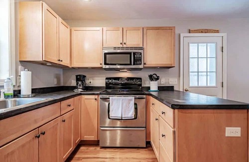 Conway House | Tranquil Paradise: Enchanting 3-Bedroom Brookside