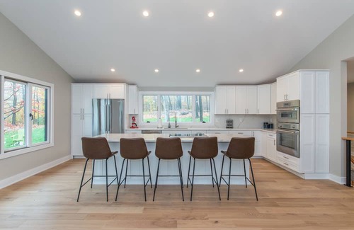 Sparta Township House | Aspen-style lakefront retreat house with hot tub, game room