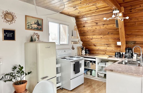 Division No. 10 Cabin | Techni Cabin offers a cozy A-frame blending rustic charm with modern comforts.