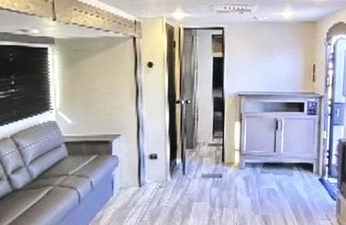 Thomson House | Come play with Scottish highland cows in a beautiful and cozy brand new RV!