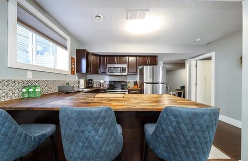 St. Albert House | Beautiful walkout basement suite with floor to ceiling windows and a great view