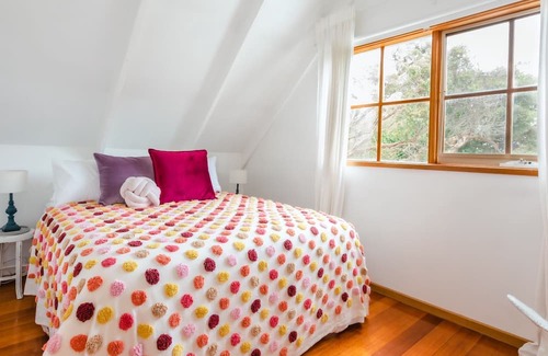 Cape Schanck House | Rosemary Cottage - you'll be greeted by a sprawling lawn and a canopy of mature trees.