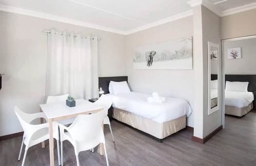 Windhoek House | Explore Avis Dam Nature Reserve! Onsite Pools, 2 Chalets w/ Kitchenette & Patio!