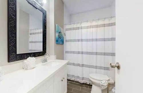 Galveston Cabin | Centrally located unit with shared courtyard, designated hot tub, & fire pit!