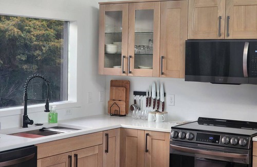 Marshland Cabin | Secluded Modern Cabin with Bluff Views, Hot Tub, Fire Pit.