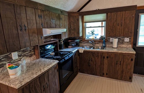 Pennellville Cabin | Entire Cabin Complex, Hot Tub, Movie Theater, 3 Private Docks