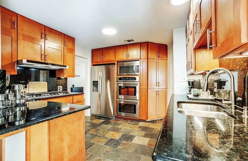 Terrell Heights House | Enchanting 4-bedroom house with Pool, Theater, Firepit and Games. Pet Friendly.