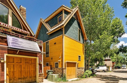 West End House | Adorable Yellow Single Family Home in Aspen's West End