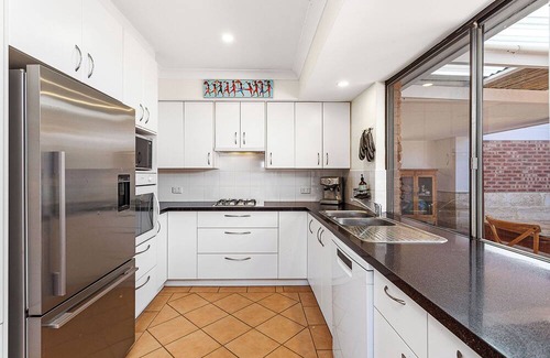 Marmion House | Welcome to your perfect family getaway in Marmion! This spacious home combines comfort, fun, and convenience — with endless entertainment for kids, modern amenities for adults, and the coast just minutes away.