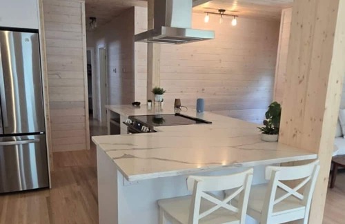 Christopher Lake Cabin | Emma Lake Sunset Bay retreat! One minute walk to the beach with large deck/yard!
