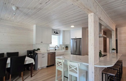 Christopher Lake Cabin | Emma Lake Sunset Bay retreat! One minute walk to the beach with large deck/yard!