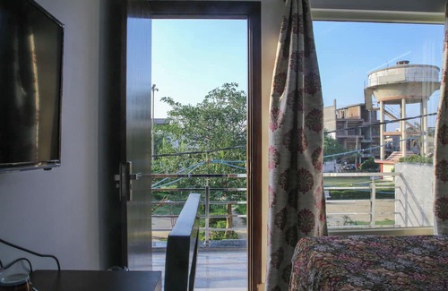 Taj Ganj Bed & Breakfast | Aradhana's Home Stay Deluxe Room with Balcony.