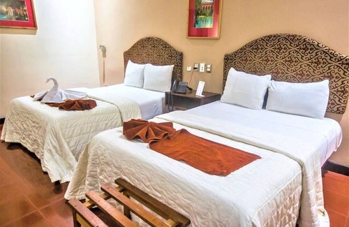 Centro Hotel | Twofold Escape: 2 Stays, 4 Beds, Steps from City Attractions