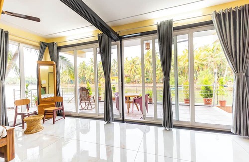 Tonse West Apartment | Riverside Retreat HomeStay – AC Studio with Breakfast Option & Boat Ride