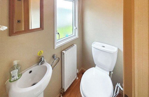 Burnham-on-Sea Apartment | Spacious caravan sleeps six, with private decking and master ensuite.