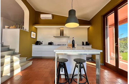 Pieve al Bagnoro House | An oasis of peace and warmth of home, amidst thoughtful design and views toward the hills.