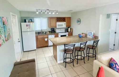 Cocoa Beach House | Fiesta Flamingo Cottage: Your Cocoa Beach Paradise with Kayaks & Bikes