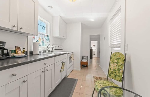 Mango Groves House | Steps from the Ocean - Pet Friendly Two Bed One Bath Beach Cottage