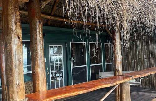 Dickinson House | Charming 2-bedroom house with hot tub and dock right on the San Leon bay