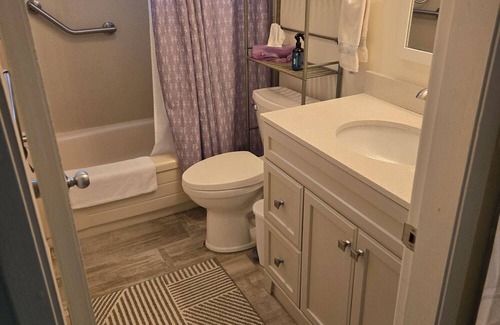 Booktown Apartment | Fully furnished garden suite one block from downtown, ocean in charming Sidney