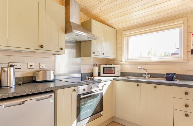 A cosy one bedroom lodge with a master bedroom served by a bathroom with a separate shower open plan