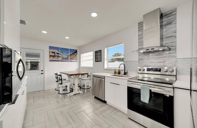 Relaxing AF Tampa Home with Hot Tub, Outside Fun, and TVs in every room!