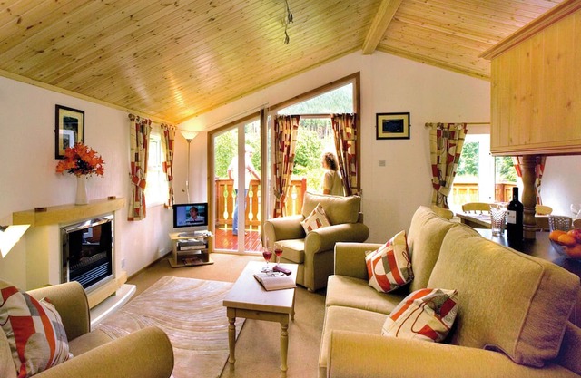 Log cabin with one double with en suite shower and two twin.