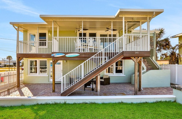 Updated home across from beach with covered balcony, central AC, & washer/dryer