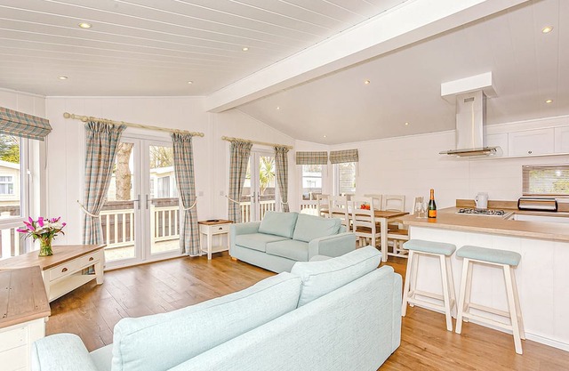This contemporary and spacious lodge is ideal for a family escape by the sea.