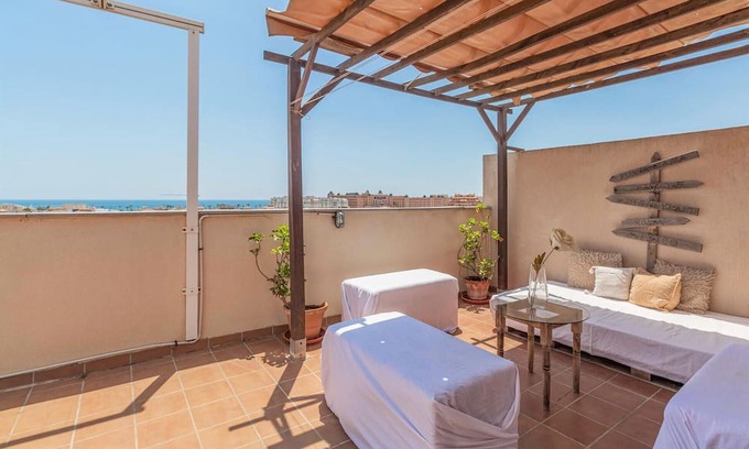 Roquetas de Mar Apartment | With a beautiful view from the roof terrace over Roquetas De Mar welcomes you this pleasant vacation