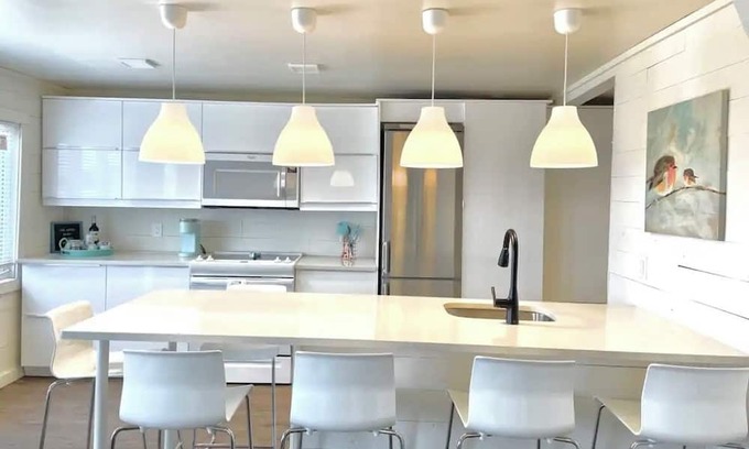 Whitewater Region Cottage | The Little Blue Beach House waterfront with shallow and sandy beach dog friendly