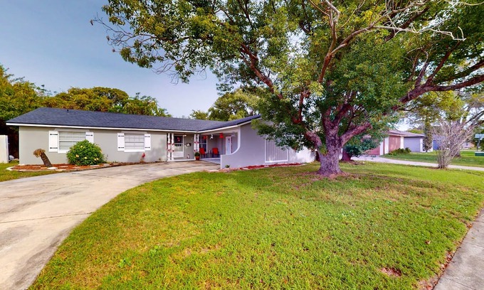 Casselberry House | Single-story home with community pool/tennis access, grill, patio, AC, & W/D