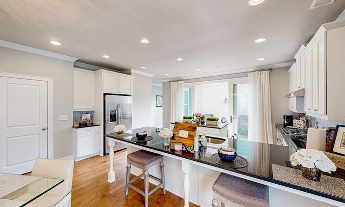 Roswell House | Peaceful & sun-filled getaway with courtyard, grill, games, & lovely fireplace