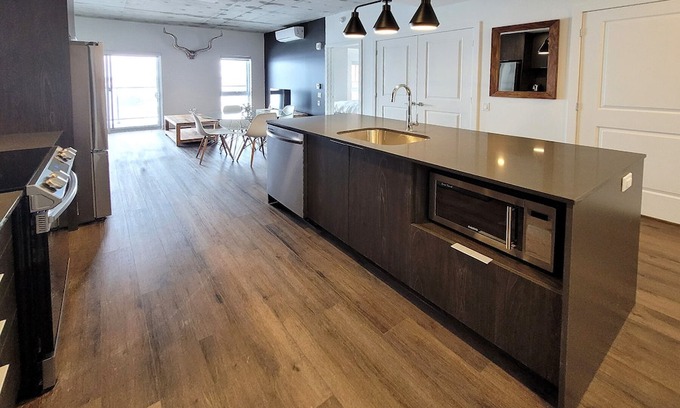 Fabreville Apartment | Corporate Stays -Relax & unwind with 1BR exclusive amenities with Rooftop Access