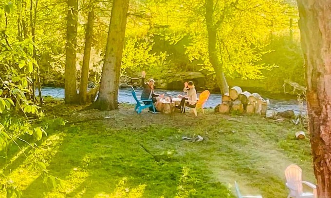 Joseph Cottage | Camp-themed dog-friendly cabin with mountain views, firepit, & river access