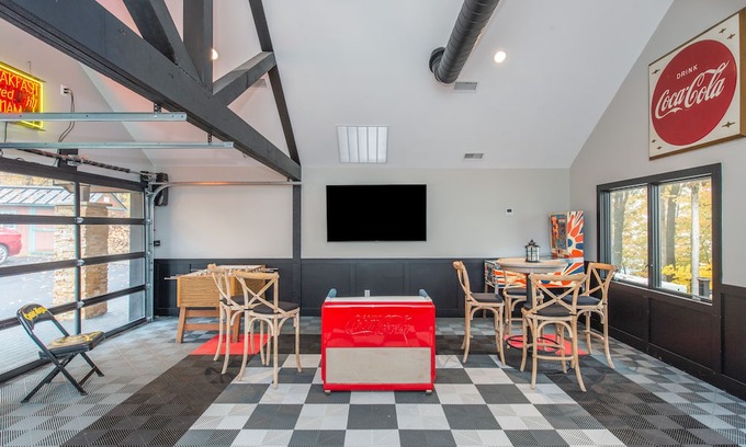 Sparta Township House | Aspen-style lakefront retreat house with hot tub, game room