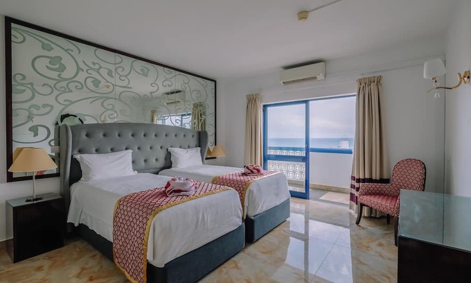 Oura Hotel | Beachfront Hotel with Indoor & Outdoor Pool! 2 Homely Units with Full Kitchens!